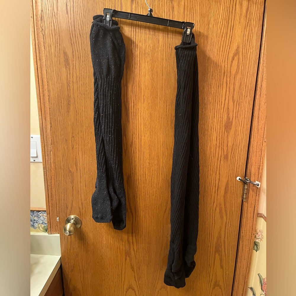 2 pairs of over the knee socks. One ribbed solid black and one black confetti.
